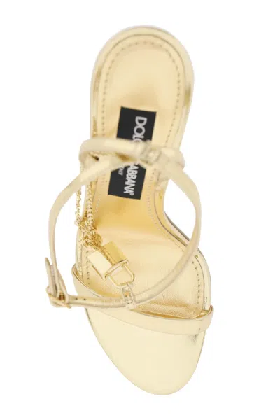 Shop Dolce & Gabbana Laminated Leather Sandals With Charm In Gold For Women