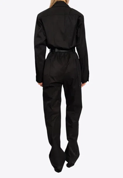 Shop Saint Laurent Belted Long-sleeved Jumpsuit In Black