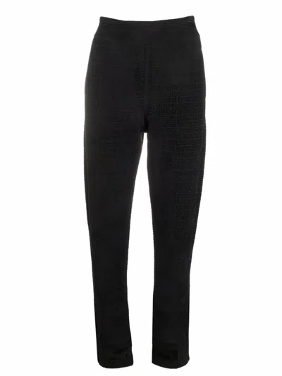 Shop Givenchy Monogram Print Tapered Trousers In Black