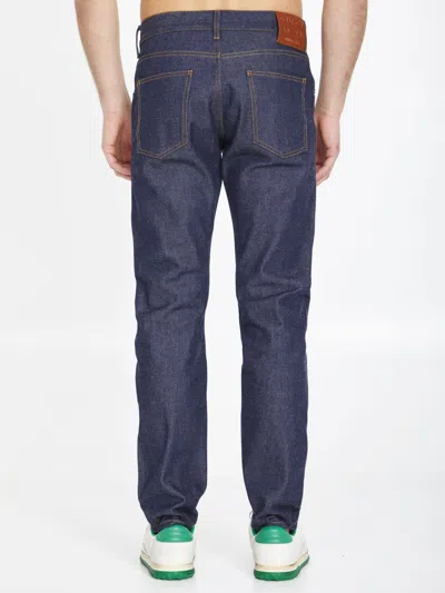 Shop Gucci Washed Blue Denim Jeans With Horsebit Embossed Leather Label