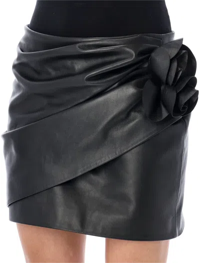 Shop Magda Butrym Black Leather Mini Skirt With Asymmetrical Draped Design And Floral Appliqué
