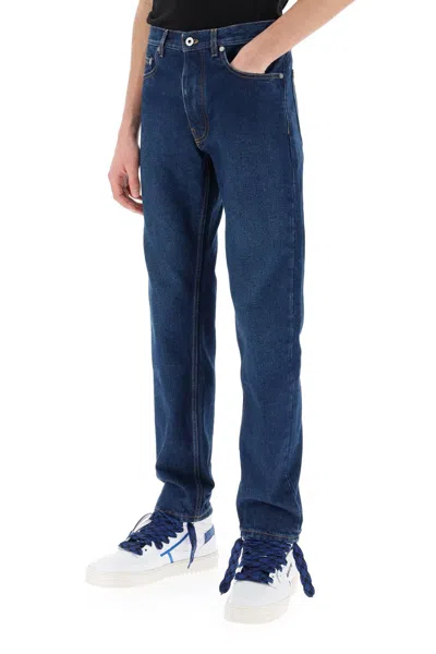 Shop Off-white Dark-washed Denim Jeans With Tapered Fit For Men In Blue