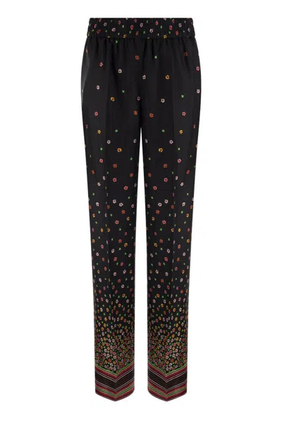 Shop Red Valentino Floral Print Silk Trousers For Women In Black
