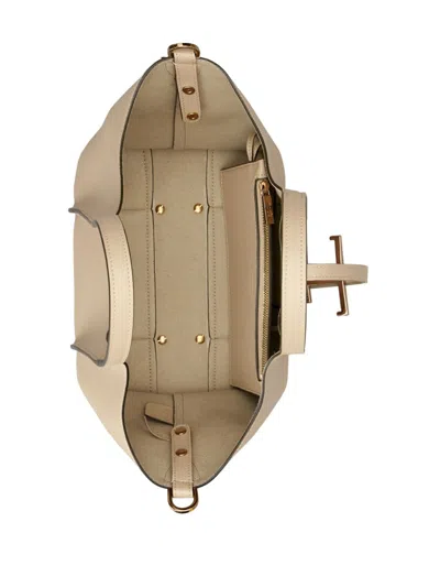 Shop Tod's Beige Grained Leather Handbag With Gold-tone Accents And Circular Handles