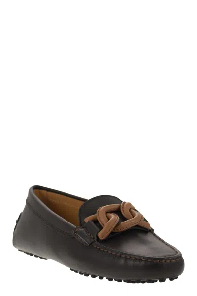 Shop Tod's Black Brushed Leather Loafer With Metal Chain Accent And Hand Stitching