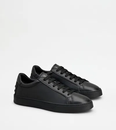 Shop Tod's Studded Leather Sneakers For Men In Black