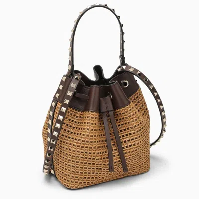 Shop Valentino Beige Woven Raffia Bucket Handbag With Brown Leather Details And Studded Accents