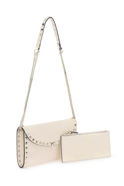 Shop Valentino Mini Hammered Leather Crossbody Bag With Iconic Studs And Detachable Pouch In White