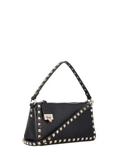 Shop Valentino Small Rockstud Grainy Calfskin Leather Handbag For Women In Black