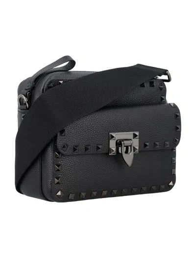 Shop Valentino Studded Leather Crossbody Handbag For Men In Black