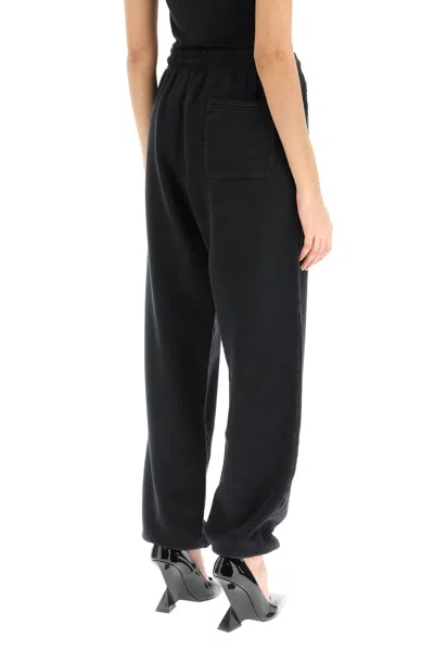 Shop Versace Black Distressed Jogger Pants With Logo Embroidery For Women