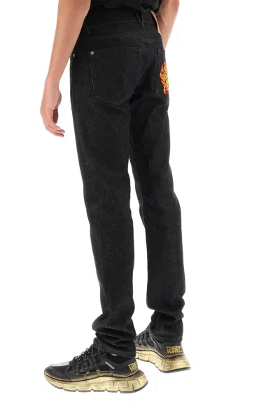 Shop Versace Black Flame Embroidered Slim Fit Five-pocket Men's Jeans For Fw23