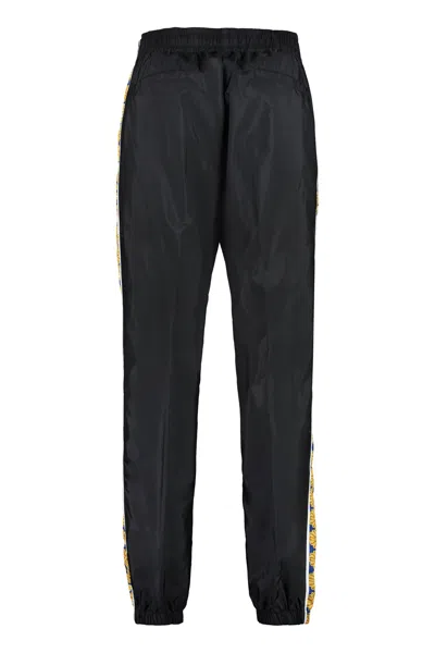 Shop Versace Men's Contrast Side Stripe Track Pants For The Ss23 Season In Black