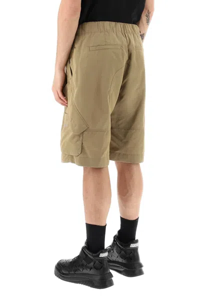Shop Versace Oversized Nylon Cargo Shorts For Men In Beige For Ss23