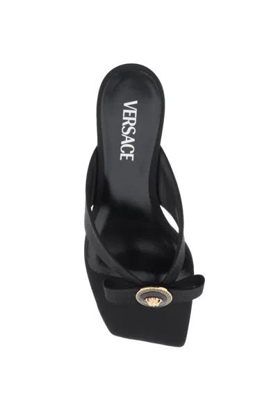 Shop Versace Satin Thong Flat With Gianni Ribbon And Enamel Medusa Detail For Women In Black
