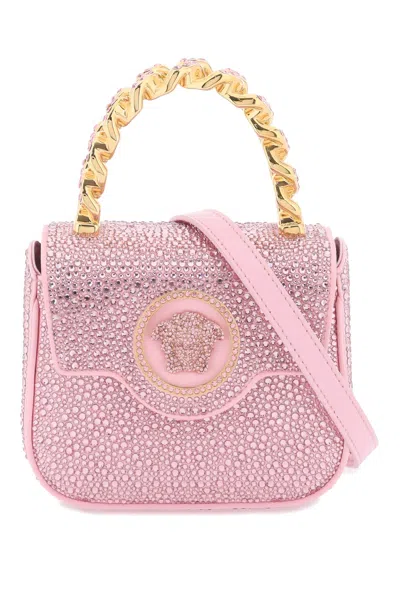 Shop Versace Satiny Pink Handbag With Crystals And Iconic Medusa Appliqué