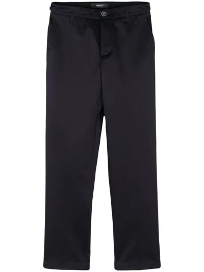 Shop Versace Signature Cotton Trousers For Men In Navy Blue
