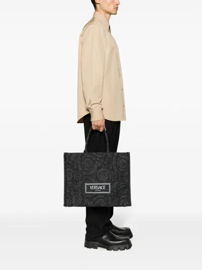 Shop Versace Sophisticated Black And Gold Baroque Jacquard Tote Handbag For Men