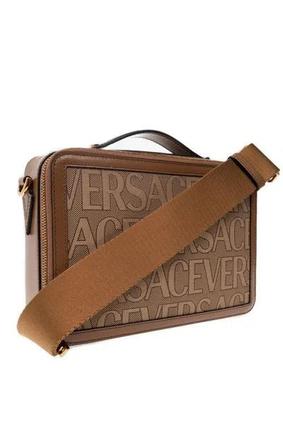 Shop Versace Versatile All-over Logo Printed Canvas Messenger Handbag In Beige For Men