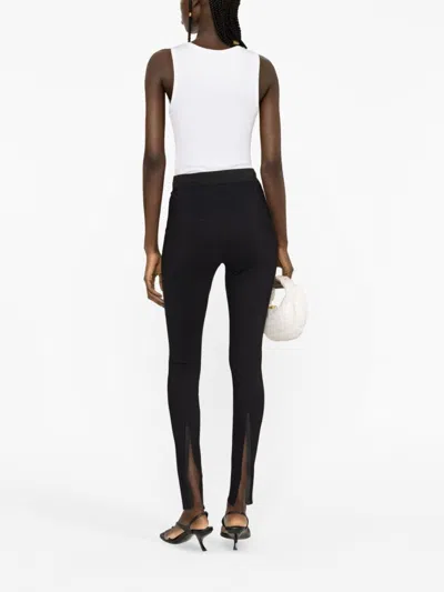 Shop Wardrobe.nyc Black Elasticated-waist Rear-slit Leggings For Women