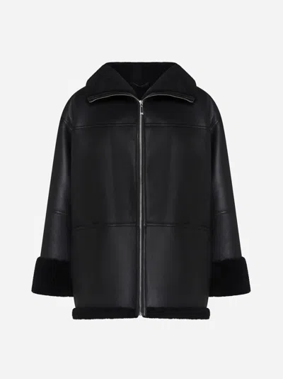 Shop Totême Leather And Shearling Jacket In Black