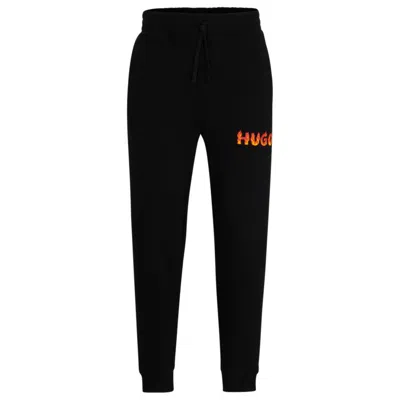 Hugo Boss Cotton-terry Tracksuit Bottoms With Puffed Flame Logo In Black