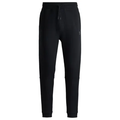 Shop Hugo Boss Cotton-terry Tracksuit Bottoms With Logo Patch In Black