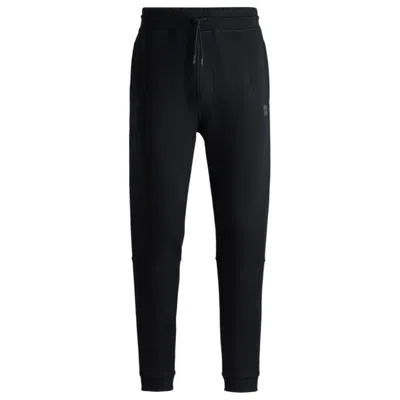 Hugo Boss Cotton-terry Tracksuit Bottoms With Logo Patch In Black