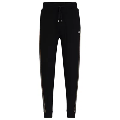 Shop Hugo Boss Tracksuit Bottoms With Embroidered Logo In Black
