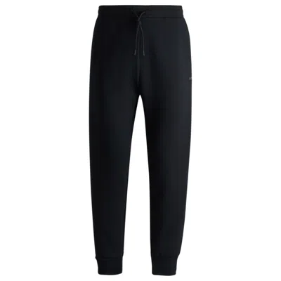 Shop Hugo Boss Stretch-cotton Tracksuit Bottoms With Logo Print In Black