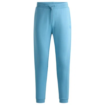 Shop Hugo Boss Cotton-terry Tracksuit Bottoms With Logo Patch In Blue