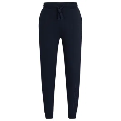 Shop Hugo Boss Cotton-terry Tracksuit Bottoms With Embroidered Logo In Blue