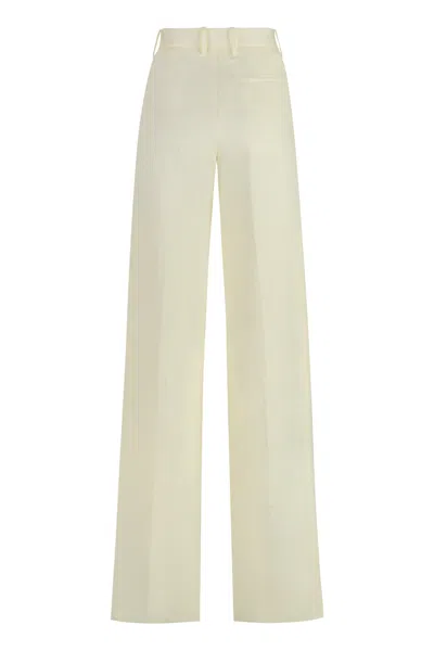 Shop Bottega Veneta Yellow Linen Trousers For Women