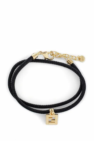 Shop Fendi Sleek Black And Gold Round Leather Bracelet For Women In Orange