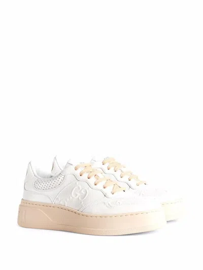 Shop Gucci Embossed Lace-up Sneakers For Women In White