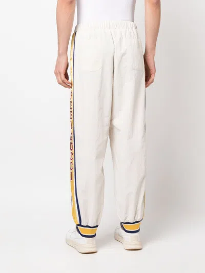 Shop Gucci Men's Striped Elastic Track Pants In White For Fw23