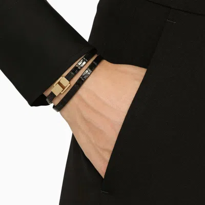 Shop Saint Laurent Black Leather Bracelet With Double Twist Design And Metal Clasp For Women
