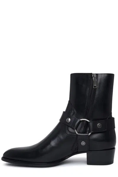 Shop Saint Laurent Luxurious Leather Wyatt Harness Boots For Men In Black