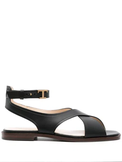 Shop Tod's Black Leather Flat Sandals With Gold-tone Details And Branded Footbed