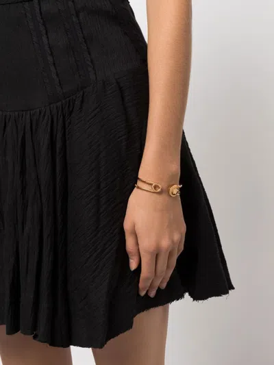 Shop Versace Gold Safety Pin Bracelet With Medusa Detail