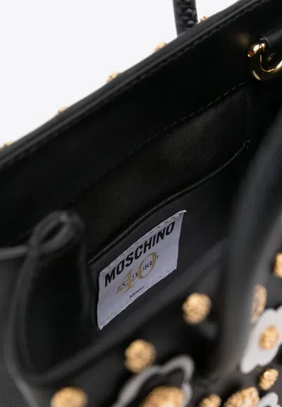 Moschino All-over Floral-appliques Top Handle Bag In Black