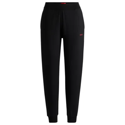 Hugo Boss Relaxed-fit Tracksuit Bottoms With Contrast Logo In Black