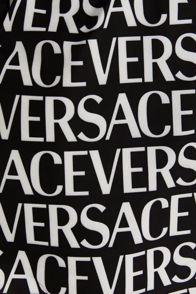 Shop Versace Men 'logomania' Swimming Trunks In Multicolor