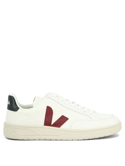 Shop Veja V-12 Sneakers & Slip-on In White