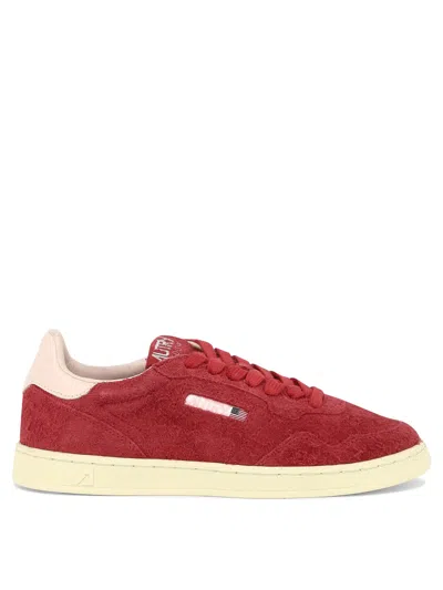 Shop Autry Med Low Sneakers & Slip-on In Red