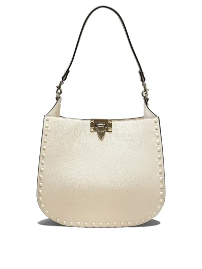 Shop Valentino Hobo Rockstud Shoulder Bags White