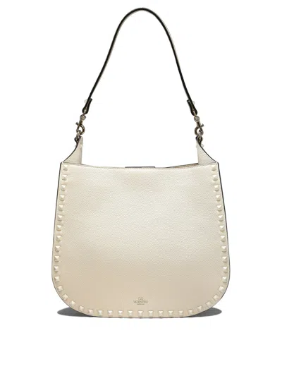 Shop Valentino Hobo Rockstud Shoulder Bags White