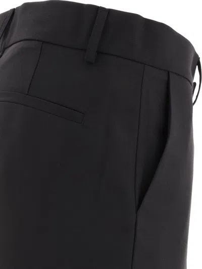 Shop Dolce & Gabbana Technical Fabric Pants With Metal Dg Logo Trousers Black