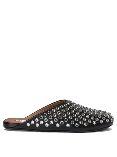Shop Alaïa Mules With Rhinestones Loafers & Slippers In Black