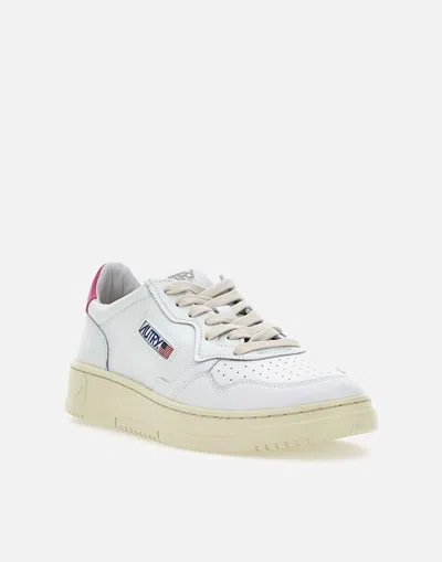 Shop Autry Sneakers In White/fuchsia